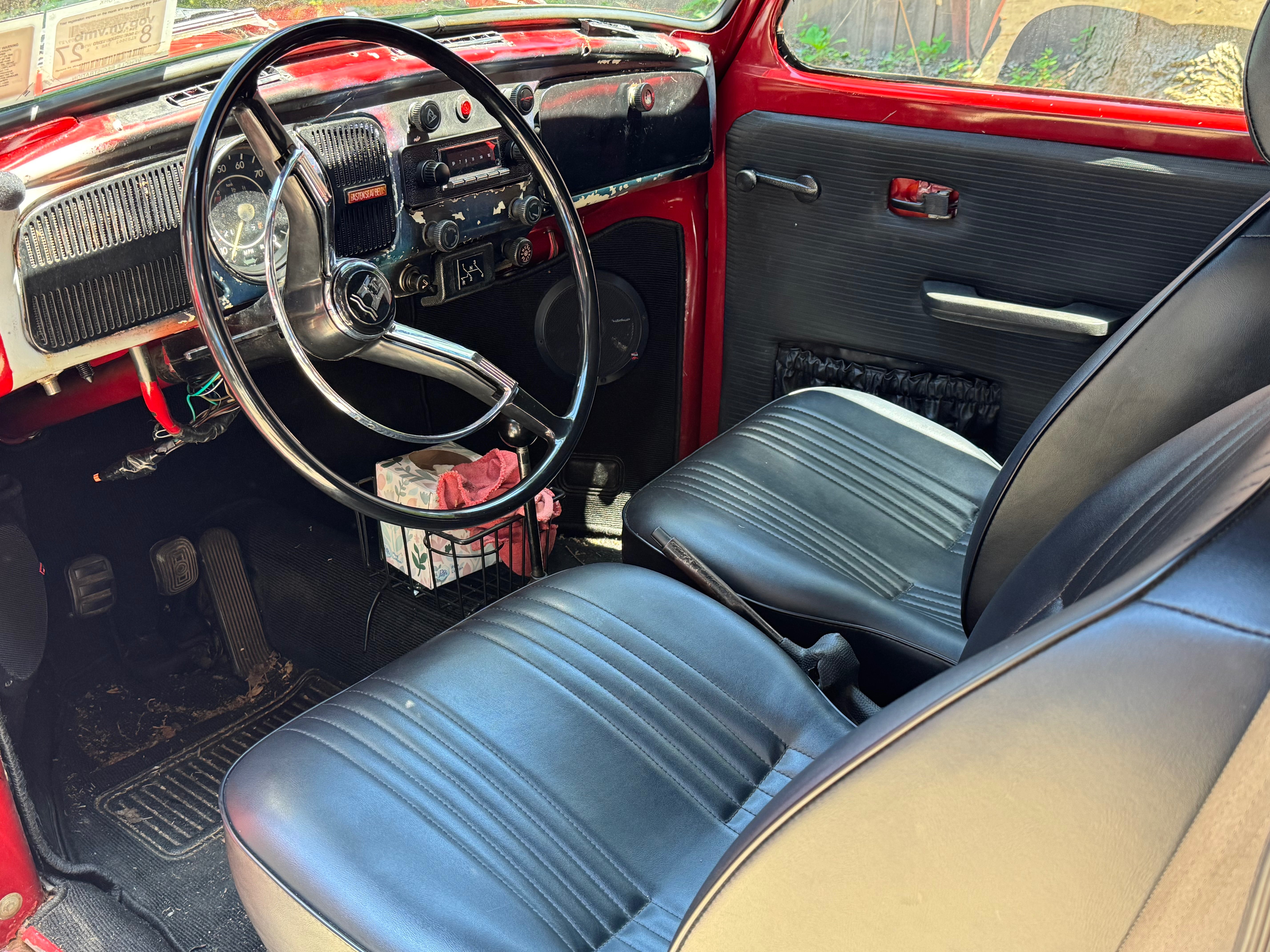 Driver's side interior view showing seats and dashboard